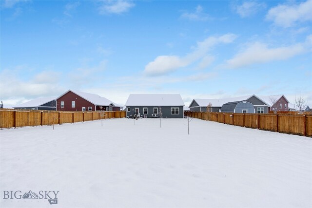 view of yard covered in snow