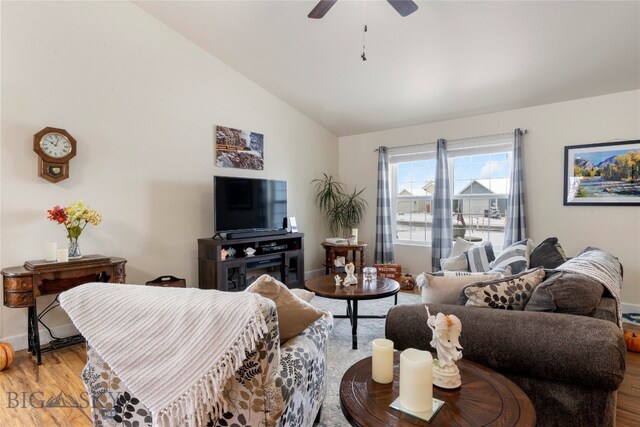 living room featuring light wood-type flooring, vaulted ceiling, and ceiling fan