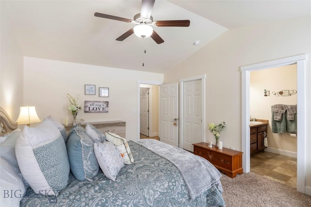 2309 Sturnella Ln, Belgrade, MT 59714 - bedroom featuring vaulted ceiling, light carpet, ceiling fan, and ensuite bath