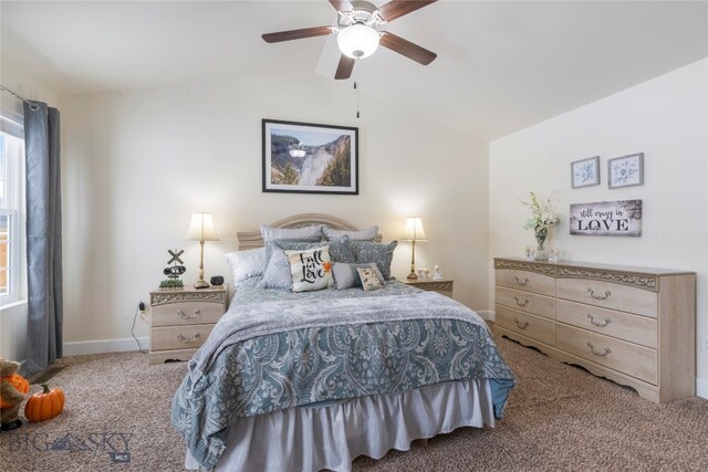 carpeted bedroom with ceiling fan and lofted ceiling