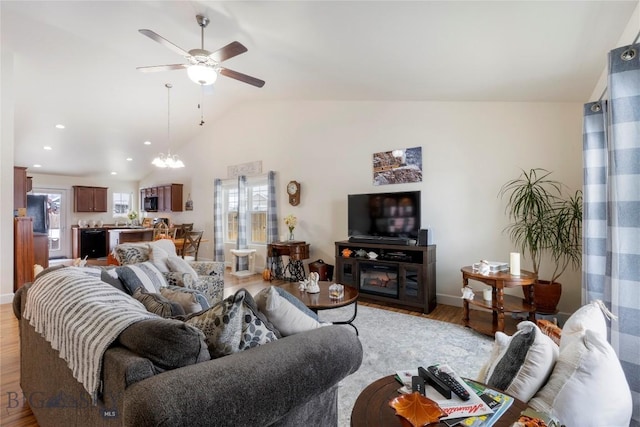 2309 Sturnella Ln, Belgrade, MT 59714 - living room featuring healthy amount of natural light, light wood-style floors, vaulted ceiling, ceiling fan, and recessed lighting