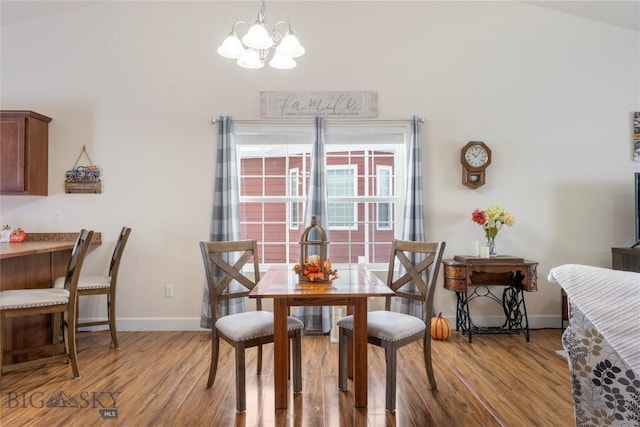 2309 Sturnella Ln, Belgrade, MT 59714 - dining room with a chandelier and wood finished floors