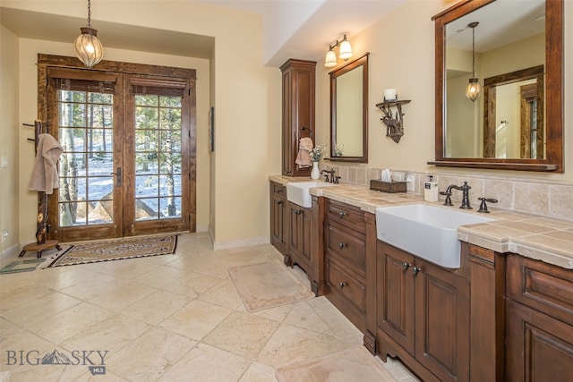 bathroom featuring french doors and vanity