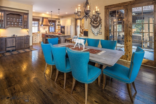 dining room featuring a chandelier and dark hardwood / wood-style floors