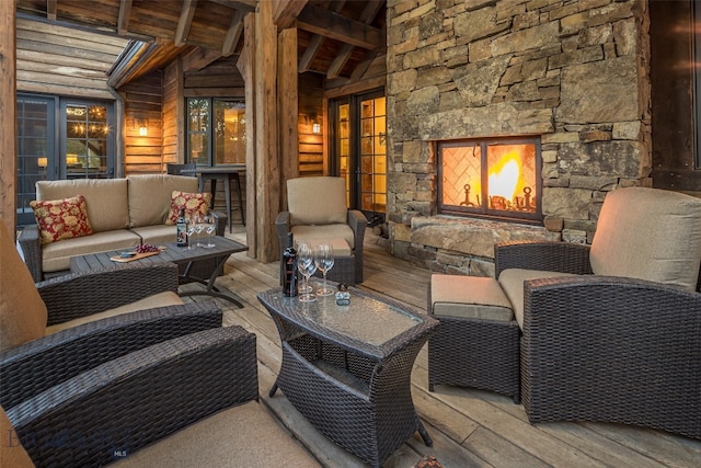 exterior space with an outdoor living space with a fireplace