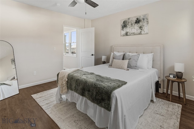 bedroom with ceiling fan and dark wood-type flooring