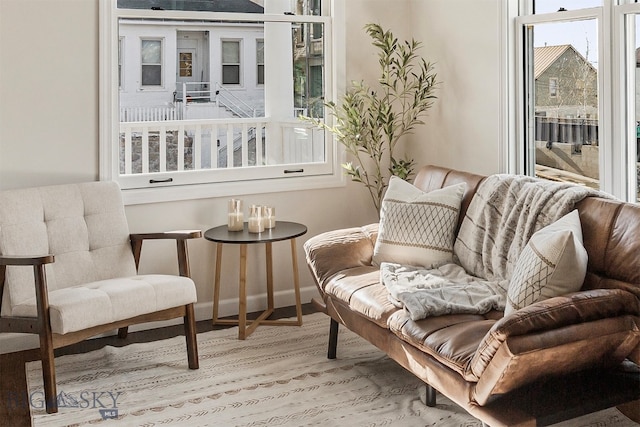 living area with hardwood / wood-style flooring