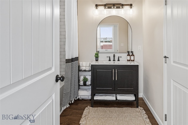 bathroom featuring hardwood / wood-style floors and vanity