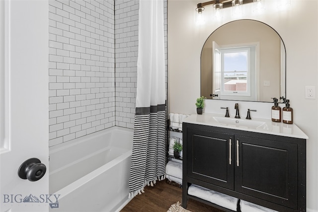 bathroom featuring wood-type flooring, vanity, and shower / bath combo with shower curtain