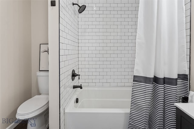 bathroom featuring shower / bath combination with curtain and toilet