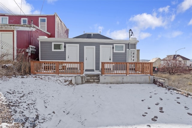 view of snow covered house