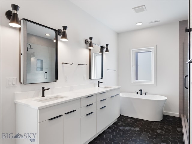 bathroom featuring separate shower and tub, tile patterned floors, and vanity