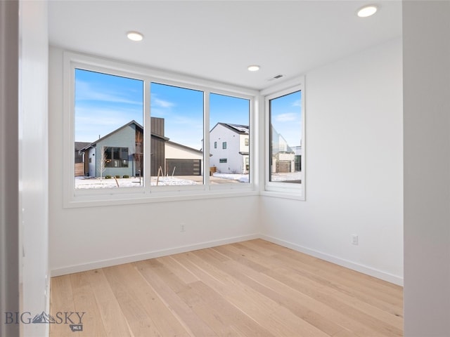 unfurnished room featuring light wood-type flooring