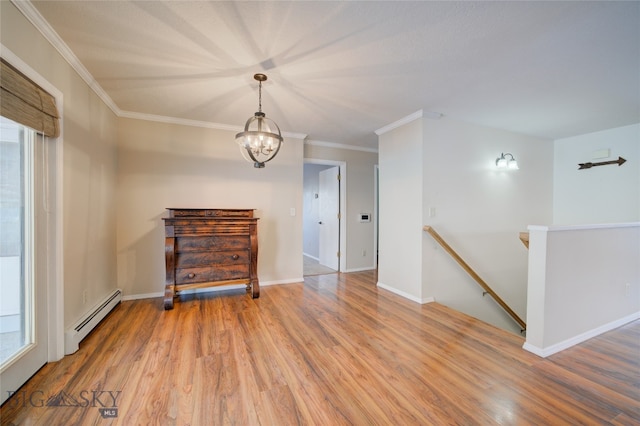 unfurnished room featuring hardwood / wood-style floors, plenty of natural light, crown molding, and a baseboard radiator