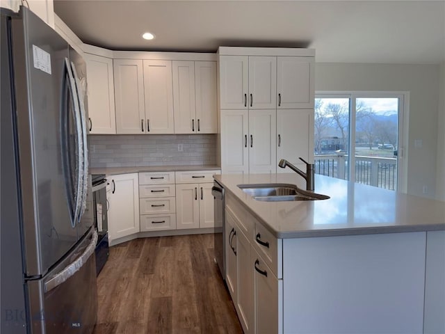 206 Otis Ave, Ennis, MT 59729 - kitchen featuring stainless steel appliances, dark wood-type flooring, light countertops, white cabinets, and recessed lighting