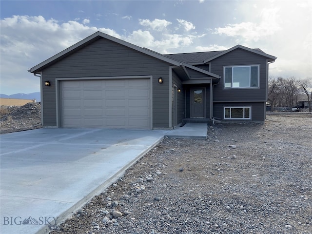 view of front of home featuring a mountain view and a garage