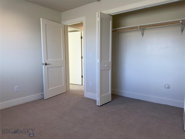206 Otis Ave, Ennis, MT 59729 - unfurnished bedroom featuring carpet flooring and a closet