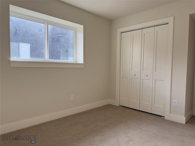 206 Otis Ave, Ennis, MT 59729 - unfurnished bedroom with light colored carpet and a closet