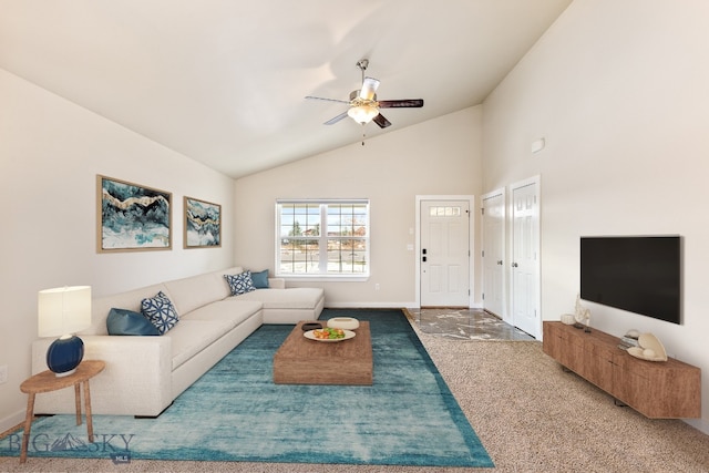 living room featuring ceiling fan, carpet floors, and high vaulted ceiling