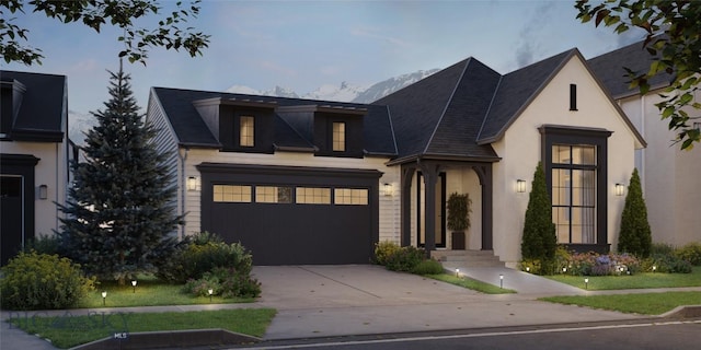 1514 Cambridge Dr, Bozeman, MT 59715 - view of front of home with driveway, a garage, stucco siding, and a shingled roof