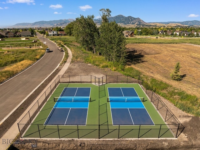 view of sport court with a mountain view