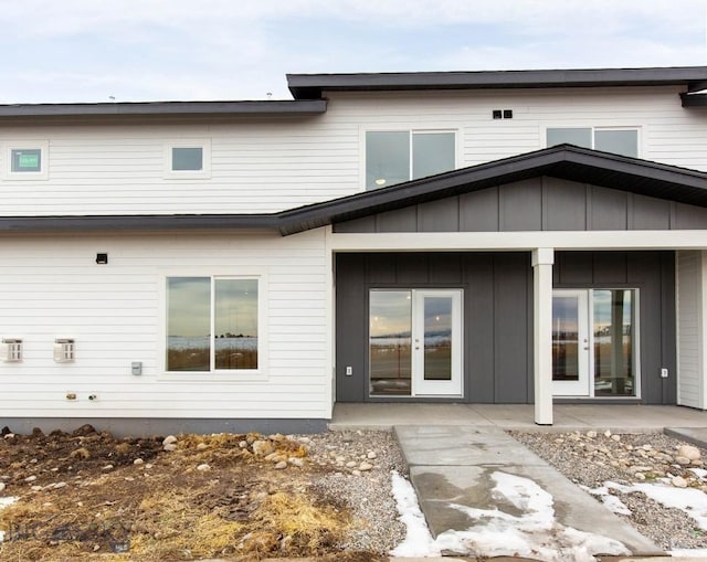 rear view of property with french doors