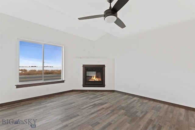 unfurnished living room featuring ceiling fan, lofted ceiling, and hardwood / wood-style flooring