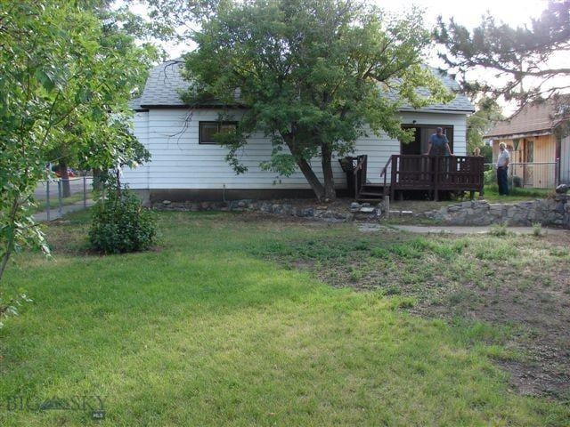 view of yard with a wooden deck