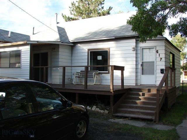 view of front of house with a wooden deck