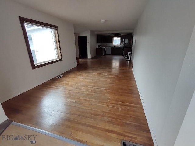 corridor featuring hardwood / wood-style flooring