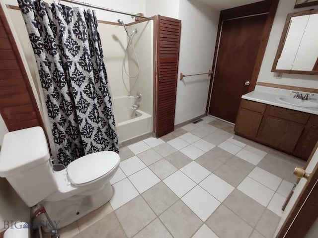 full bathroom featuring tile patterned flooring, vanity, toilet, and shower / tub combo with curtain