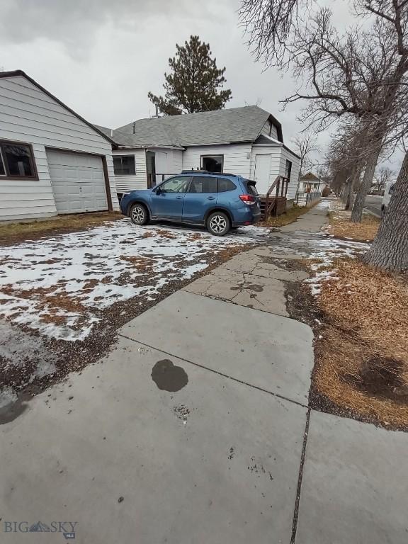 view of side of home with a garage