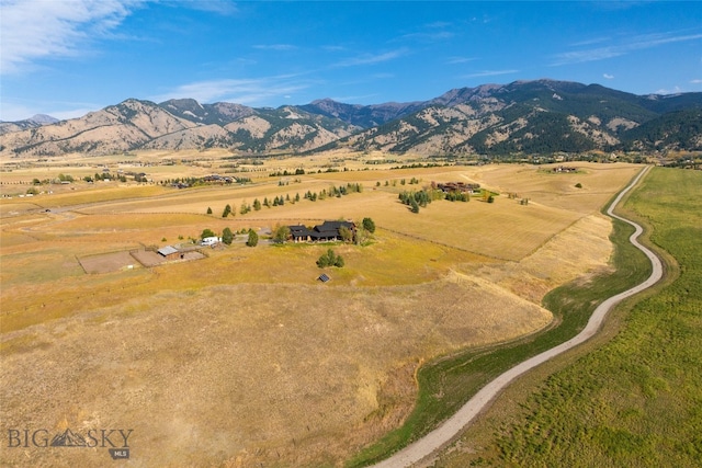 drone / aerial view with a mountain view and a rural view