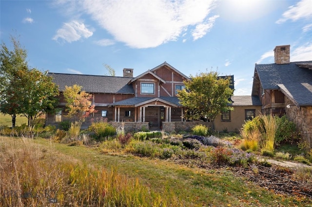 618 Autumn Ridge Rd, Bozeman, MT 59715 - craftsman-style house with a chimney and covered porch