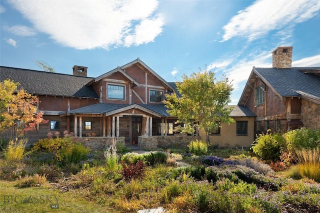 618 Autumn Ridge Rd, Bozeman, MT 59715 - view of front of property featuring a chimney and stone siding