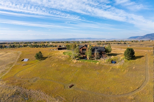 drone / aerial view featuring a mountain view and a rural view