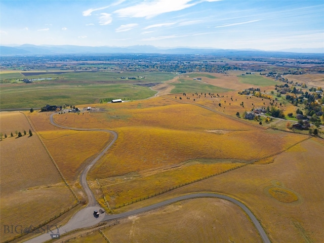 drone / aerial view with a mountain view and a rural view