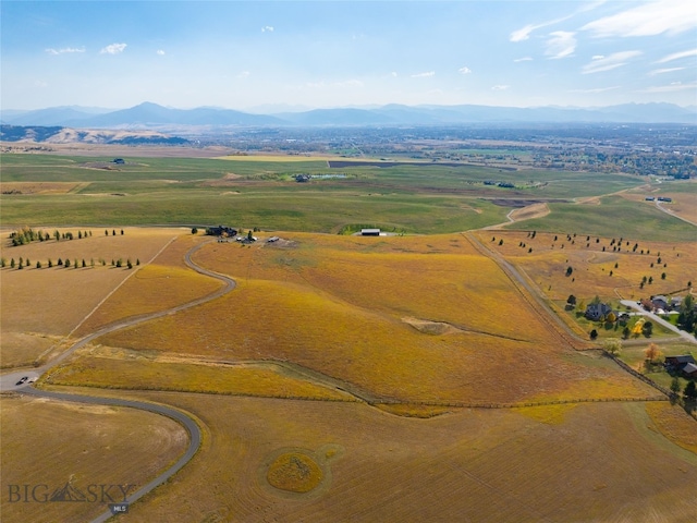 birds eye view of property featuring a mountain view and a rural view