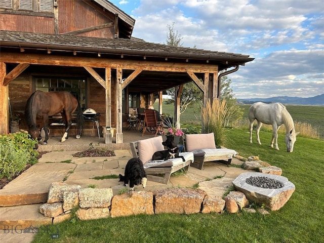 618 Autumn Ridge Rd, Bozeman, MT 59715 - view of patio with an outdoor fire pit
