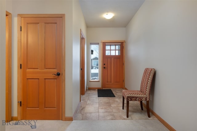 entryway featuring light tile patterned floors