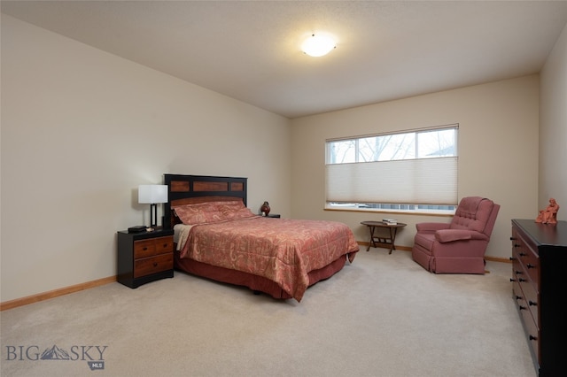 bedroom featuring light colored carpet