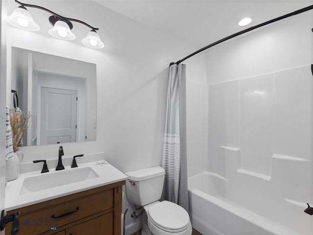full bath with shower / bath combo, vanity, and toilet