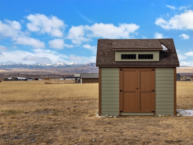 view of shed featuring a mountain view