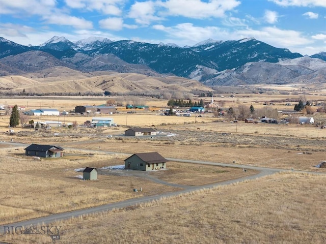 mountain view featuring a rural view