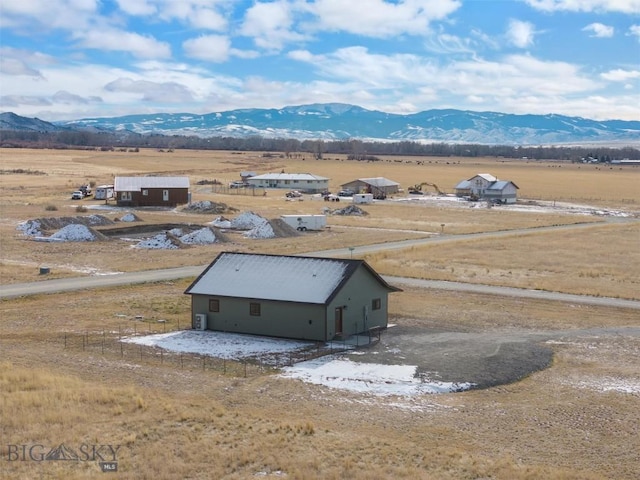 birds eye view of property featuring a mountain view and a rural view