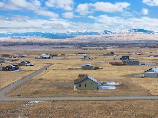 bird's eye view featuring a rural view and a mountain view