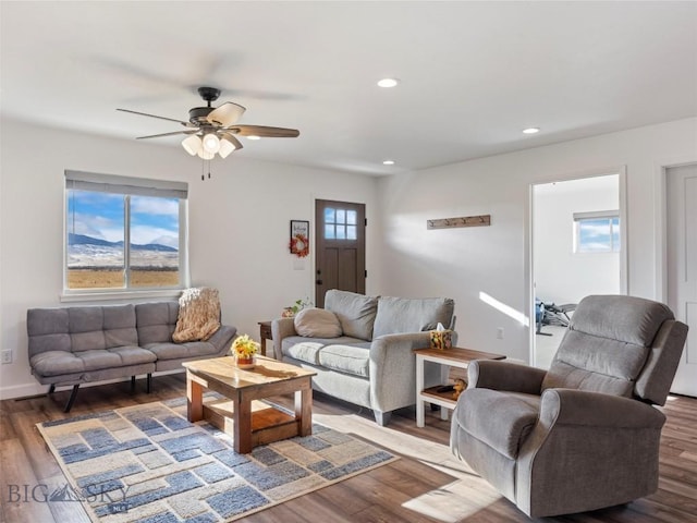 living area featuring a ceiling fan, wood finished floors, and recessed lighting