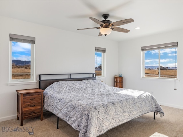 carpeted bedroom with a ceiling fan, baseboards, and recessed lighting