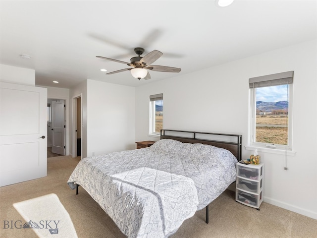 bedroom featuring a ceiling fan, baseboards, recessed lighting, and light colored carpet