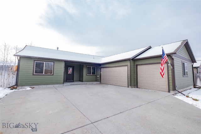 ranch-style home with a garage